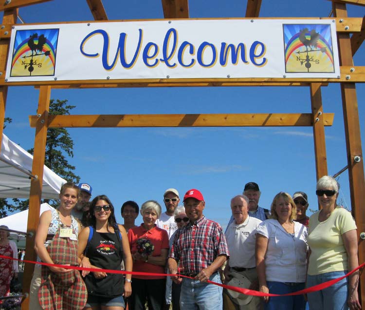 ribbon cutting under welcome sign